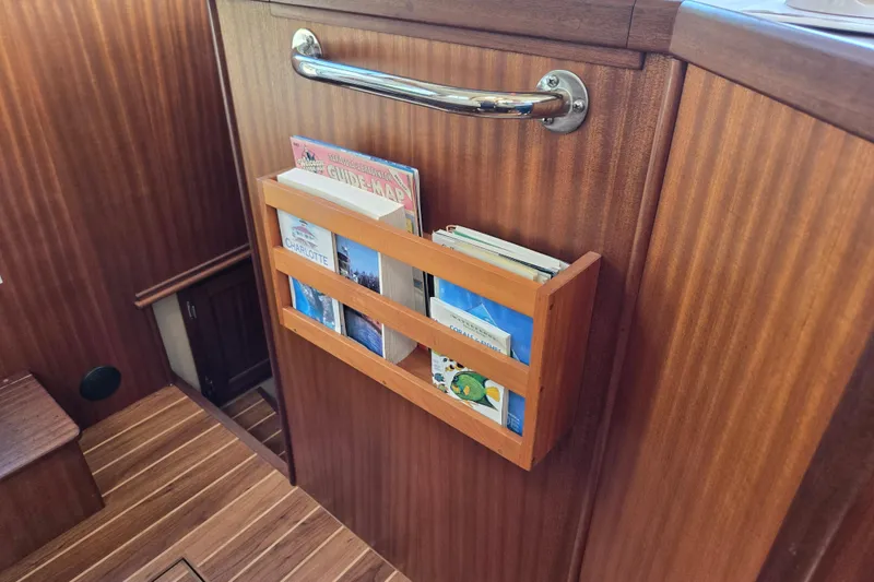 Slide: The Image of Wooden interior of 2009 American Tug 34 with built-in magazine rack. - 46