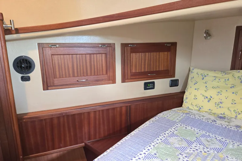 Slide: The Image of Cozy cabin interior of 2009 American Tug 34 Rare Flybridge Model with wood accents. - 52