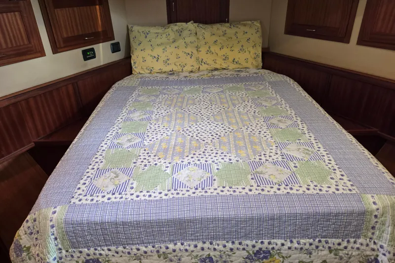 Slide: The Image of Cozy cabin bed with floral quilt in 2009 American Tug 34 Flybridge. - 53