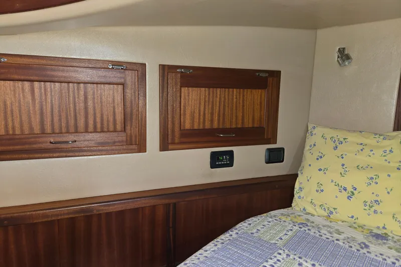 Slide: The Image of Cozy cabin interior of 2009 American Tug 34 Rare Flybridge Model with wooden cabinets. - 55