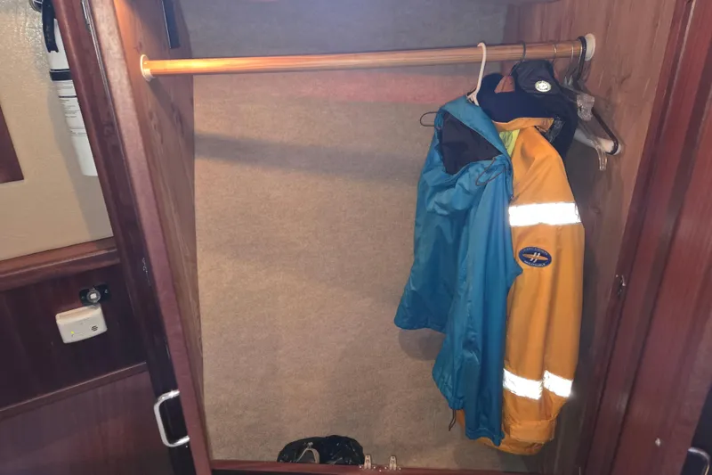 Slide: The Image of Closet with jackets inside a 2009 American Tug 34 Rare Flybridge Model boat. - 57