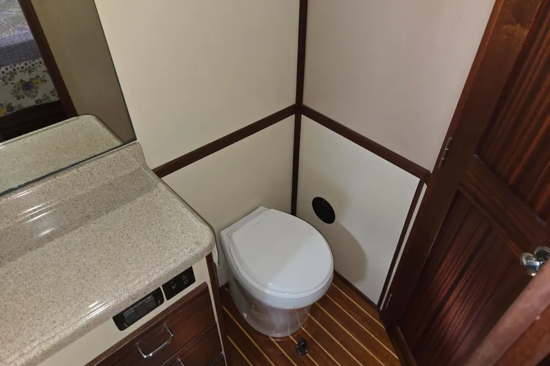 Slide: The Image of Bathroom interior of 2009 American Tug 34 Rare Flybridge Model with wood accents. - 64