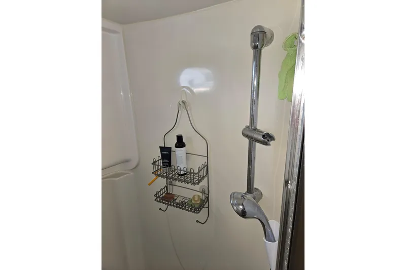 Slide: The Image of Shower area in 2009 American Tug 34 Rare Flybridge Model with toiletries and chrome fixtures. - 66