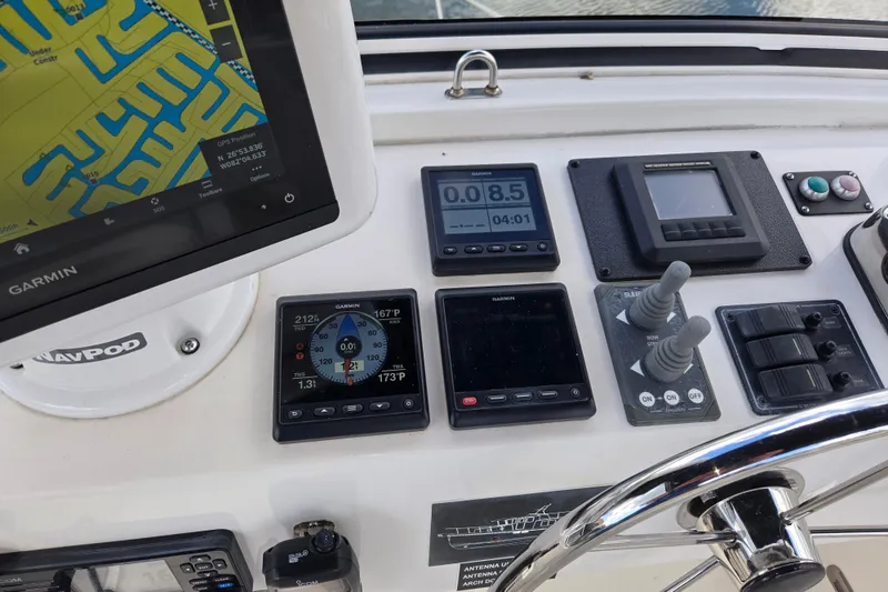 Slide: The Image of Control panel of 2009 American Tug 34 Rare Flybridge Model with navigation instruments. - 70