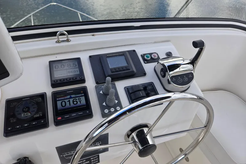 Slide: The Image of 2009 American Tug 34 Rare Flybridge Model helm with navigation instruments and controls. - 71