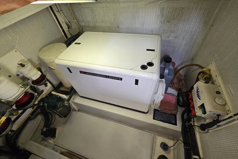 Slide: The Image of Engine room of 2009 American Tug 34, featuring Northern Lights generator. - 86