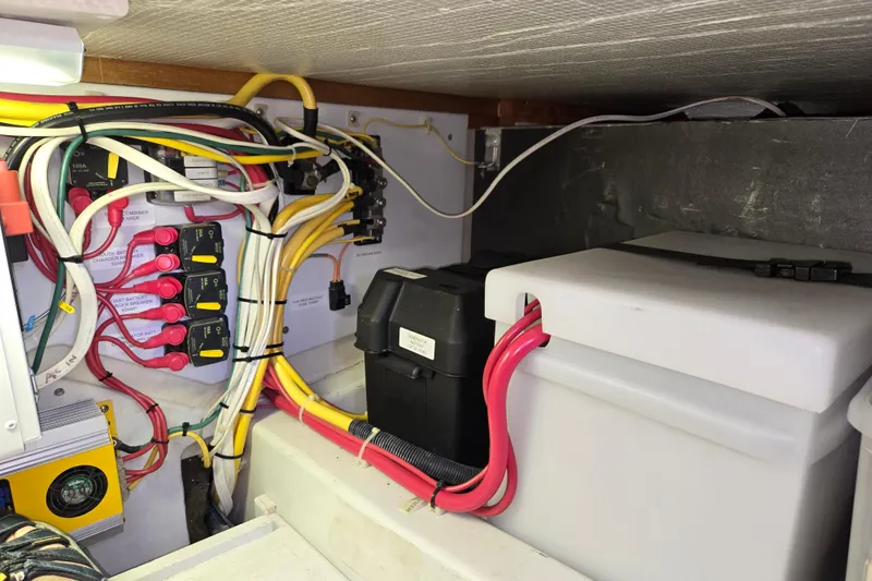 Slide: The Image of Electrical wiring and battery setup in a 2009 American Tug 34 Rare Flybridge Model. - 95