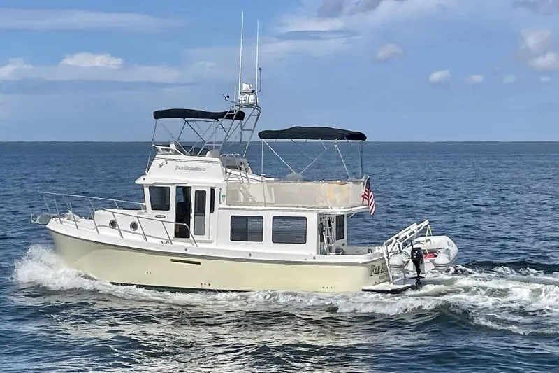 Slide: The Image of 2009 American Tug 34 Rare Flybridge Model cruising on open water. - 98