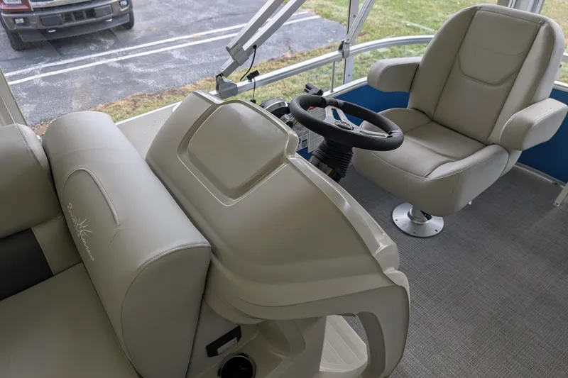 Slide: The Image of Interior of 2026 SunChaser Vista 16 LR pontoon boat with steering wheel and seating. - 11