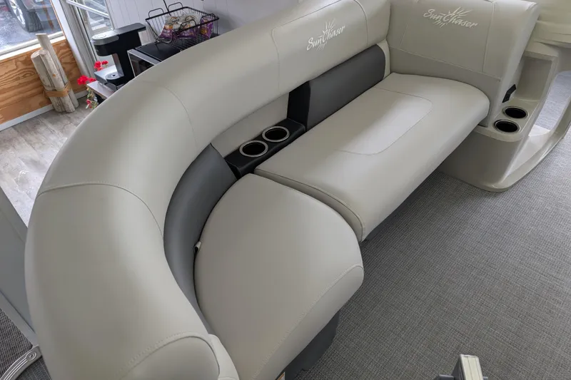 Slide: The Image of Luxurious seating on 2026 SunChaser Vista 16 LR pontoon boat with cup holders and elegant design. - 6