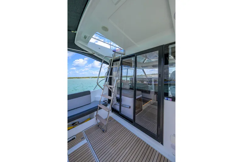 Slide: The Image of 2022 Jeanneau NC Weekender 1095 Fly, featuring sleek deck and modern interior design. - 14