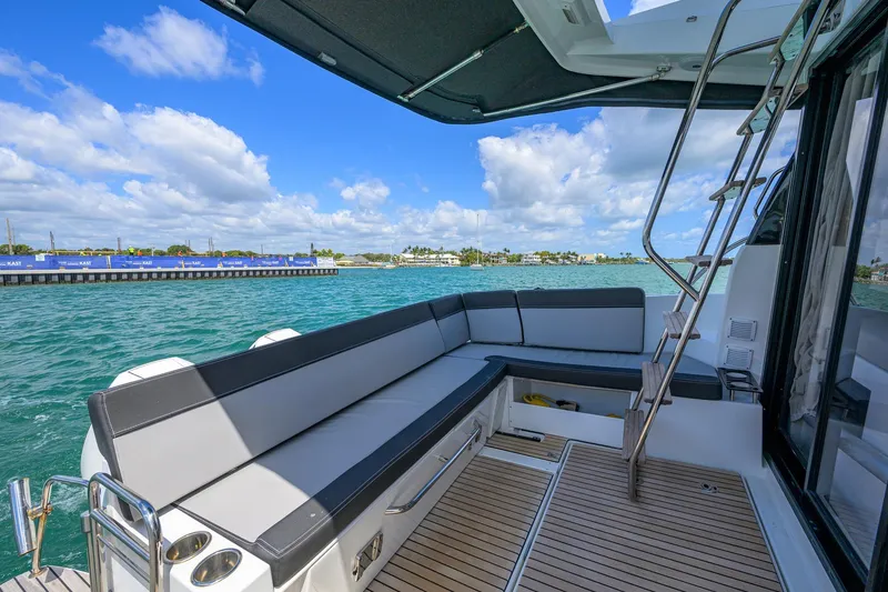 Slide: The Image of 2022 Jeanneau NC Weekender 1095 Fly boat with spacious deck seating and ocean view. - 15