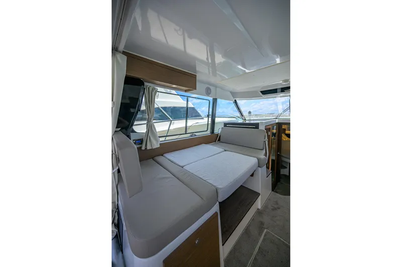 Slide: The Image of Interior of 2022 Jeanneau NC Weekender 1095 Fly, featuring a cozy seating area. - 26