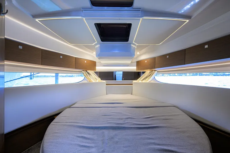 Slide: The Image of 2022 Jeanneau NC Weekender 1095 Fly cabin interior with modern design and ambient lighting. - 29