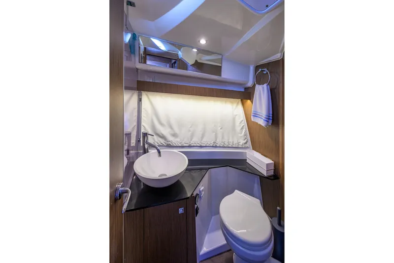 Slide: The Image of Modern bathroom in 2022 Jeanneau NC Weekender 1095 Fly yacht, featuring sleek sink and toilet. - 30
