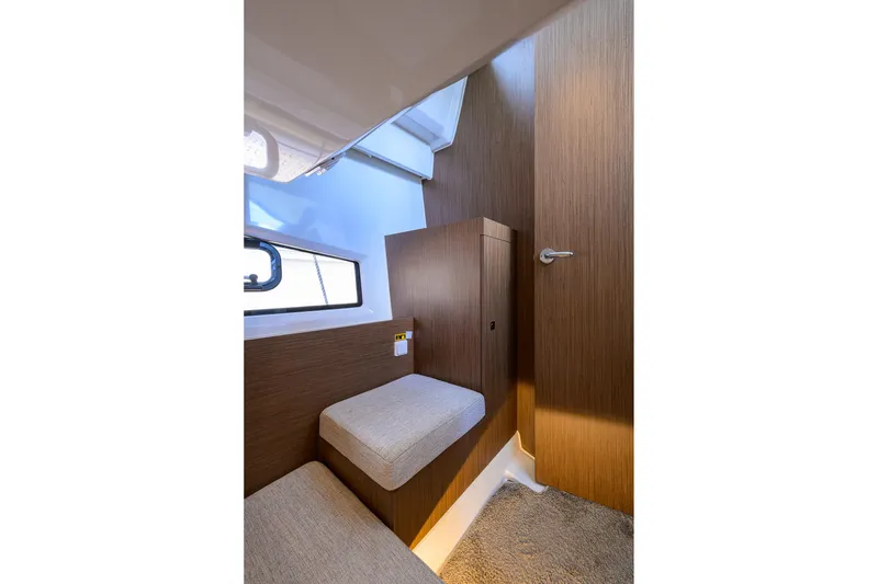 Slide: The Image of Interior cabin of 2022 Jeanneau NC Weekender 1095 Fly with wooden finish. - 33