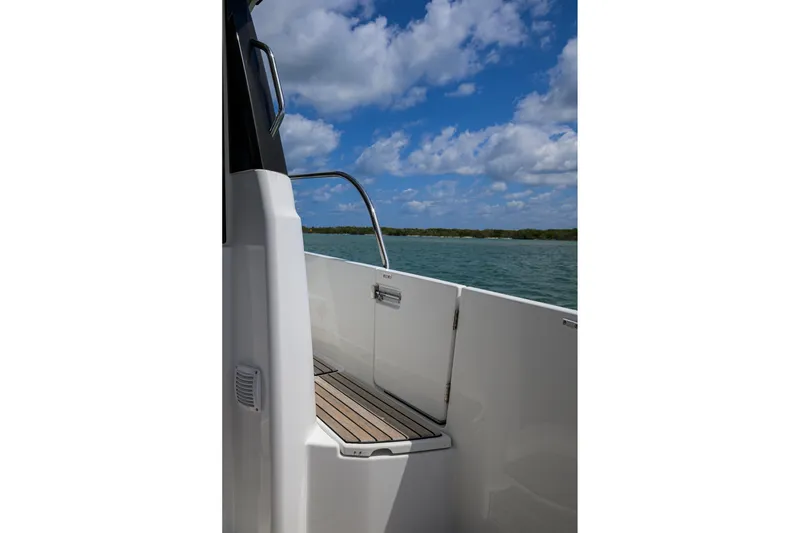 Slide: The Image of 2022 Jeanneau NC Weekender 1095 Fly boat deck with scenic water view. - 4