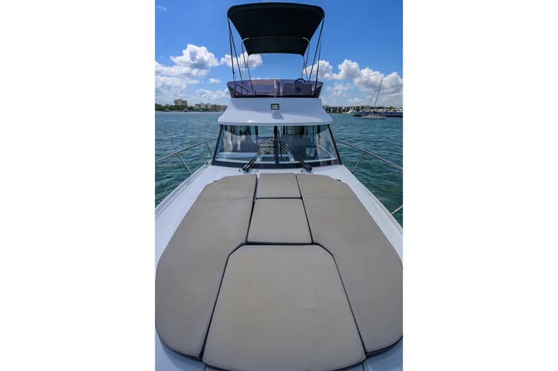 Slide: The Image of 2022 Jeanneau NC Weekender 1095 Fly on water, featuring spacious deck and flybridge. - 6