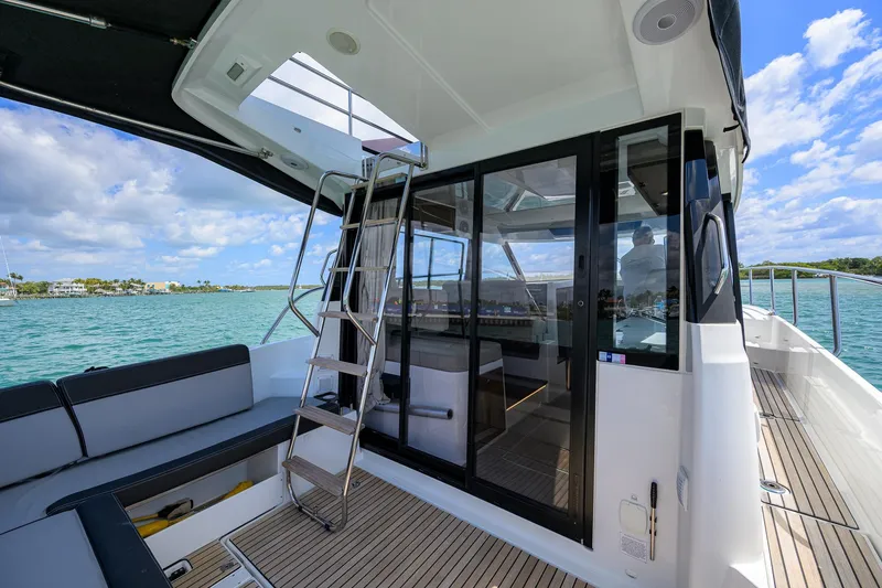 Slide: The Image of Jeanneau NC Weekender 1095 Fly 2022, featuring sleek design and spacious deck area. - 7