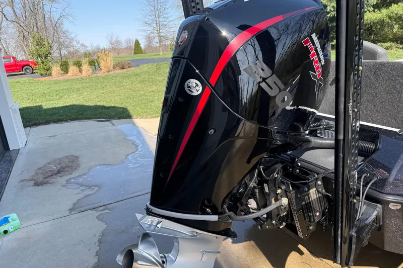 Slide: The Image of 2024 Vexus VXs20 boat with Mercury Pro XS 250 outboard motor in driveway. - 14