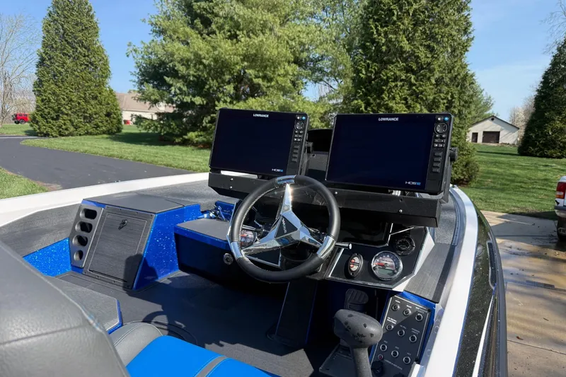 Slide: The Image of 2024 Vexus VXs20 boat dashboard with dual Lowrance displays and steering wheel. - 8