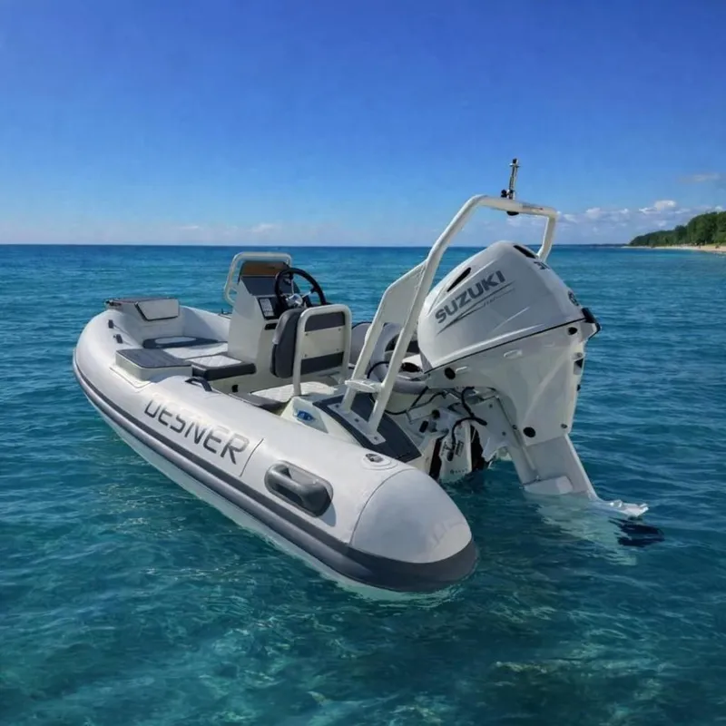 The Image of Desner SP 330 boat with Suzuki engine on clear blue water, 2026 model. - 0