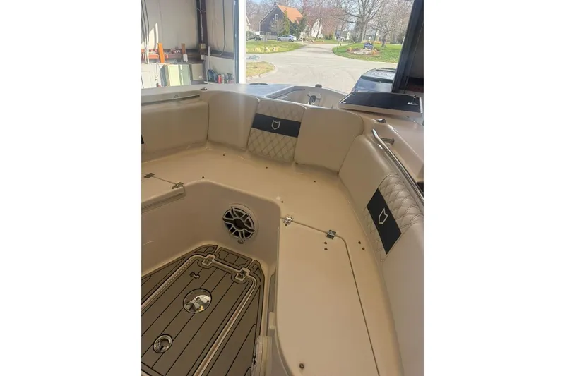 Slide: The Image of Interior view of 2024 Sea Fox 288 Commander boat, featuring cushioned seating and sleek design. - 10