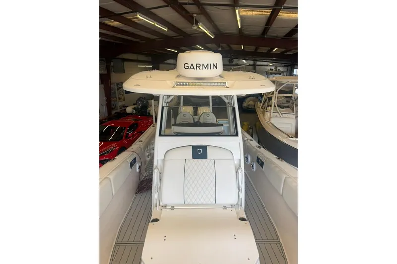 Slide: The Image of 2024 Sea Fox 288 Commander boat with Garmin equipment in a showroom. - 11