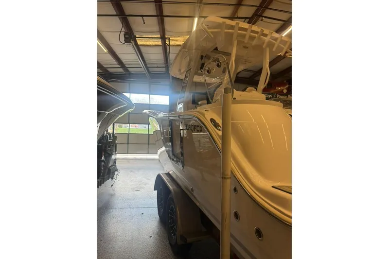 Slide: The Image of 2024 Sea Fox 288 Commander boat in a garage setting. - 5