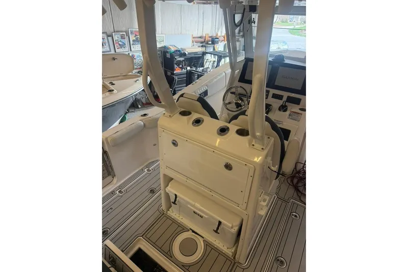Slide: The Image of 2024 Sea Fox 288 Commander boat interior with helm and seating area. - 7