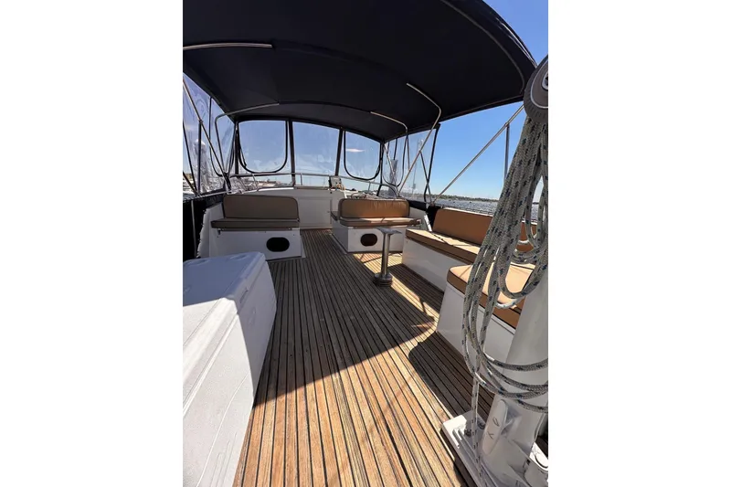 Slide: The Image of 1994 Grand Banks 42 Classic yacht deck with seating and canopy. - 13