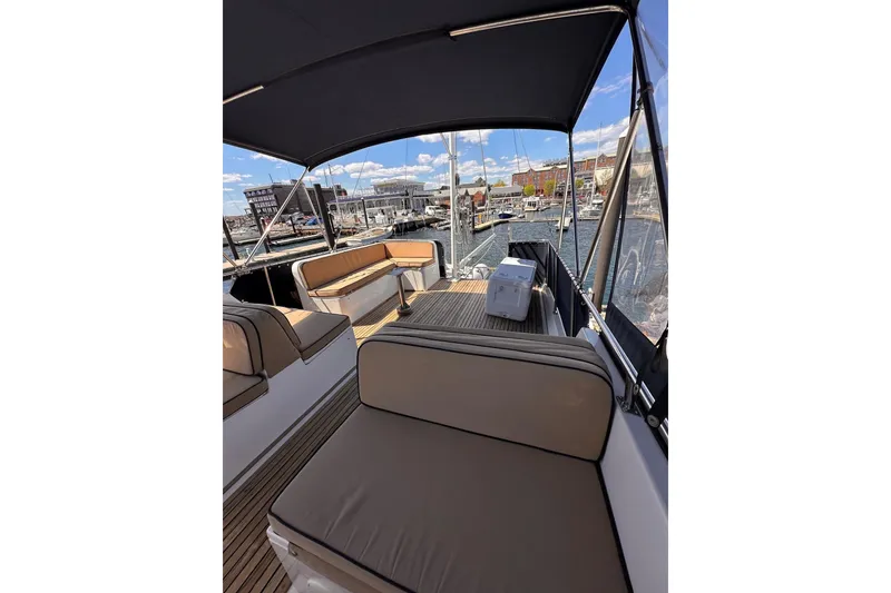 Slide: The Image of Flybridge of 1994 Grand Banks 42 Classic yacht with seating and marina view. - 15