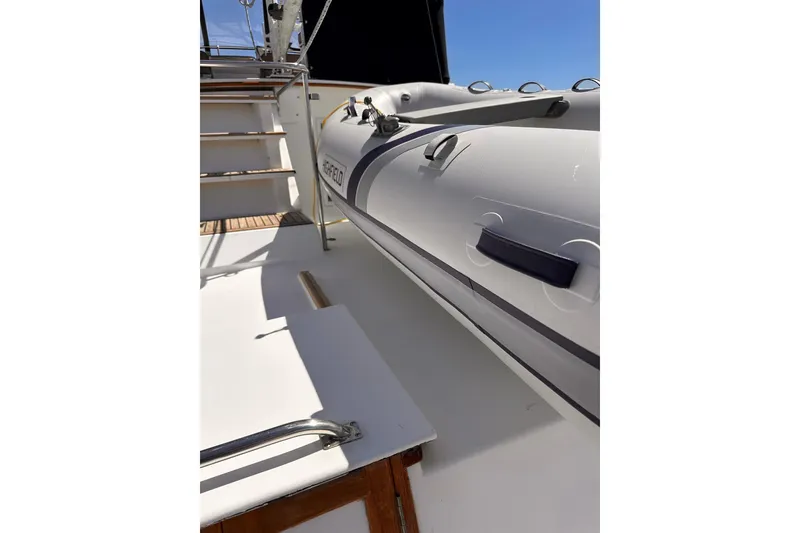 Slide: The Image of Deck view of 1994 Grand Banks 42 Classic yacht with inflatable boat. - 16