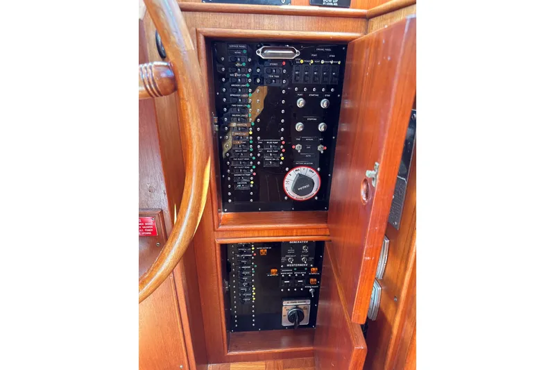 Slide: The Image of Control panel of a 1994 Grand Banks 42 Classic yacht with wooden finish. - 24