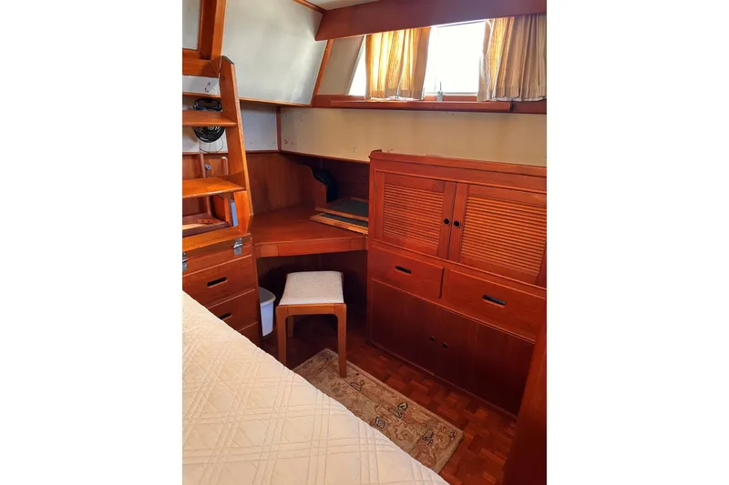 Slide: The Image of Cozy cabin interior of 1994 Grand Banks 42 Classic with wooden furniture and natural light. - 28