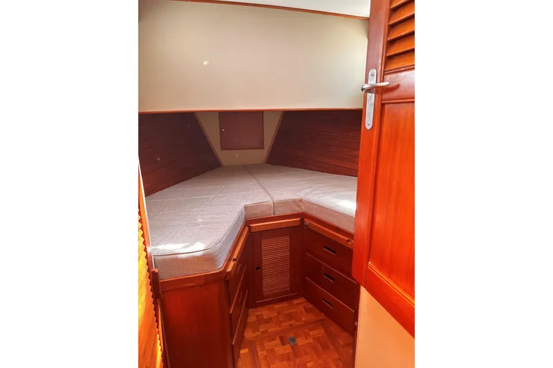 Slide: The Image of Cozy cabin interior of 1994 Grand Banks 42 Classic yacht with wooden furnishings. - 33