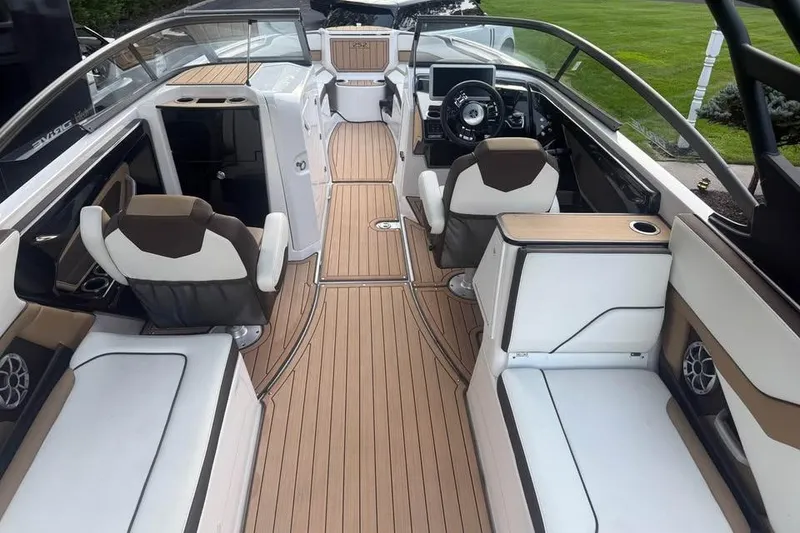 Slide: The Image of 2021 Yamaha Boats 252SD interior with sleek seating and modern dashboard design. - 2