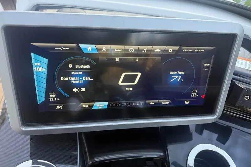 Slide: The Image of Dashboard of 2021 Yamaha Boats 252SD showing controls and music display. - 4