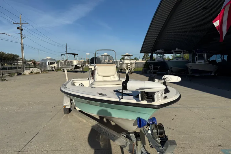 Slide: The Image of 2010 Mako 18 LTS boat on trailer in outdoor storage area. - 4