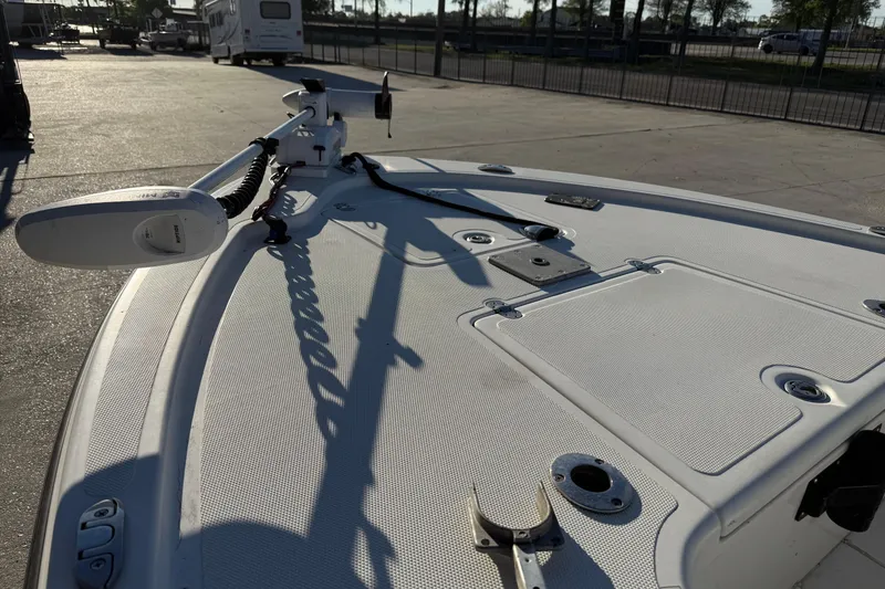 Slide: The Image of 2010 Mako 18 LTS boat deck with mounted equipment in a parking area. - 9