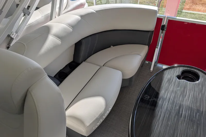 Slide: The Image of Luxurious seating in 2026 Sylvan Mirage 820 CLZ DH pontoon boat interior. - 13