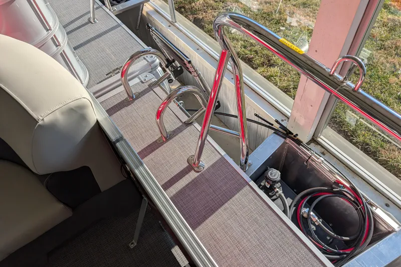 Slide: The Image of Interior view of 2026 Sylvan Mirage 820 CLZ DH pontoon boat, featuring seating and railing. - 15