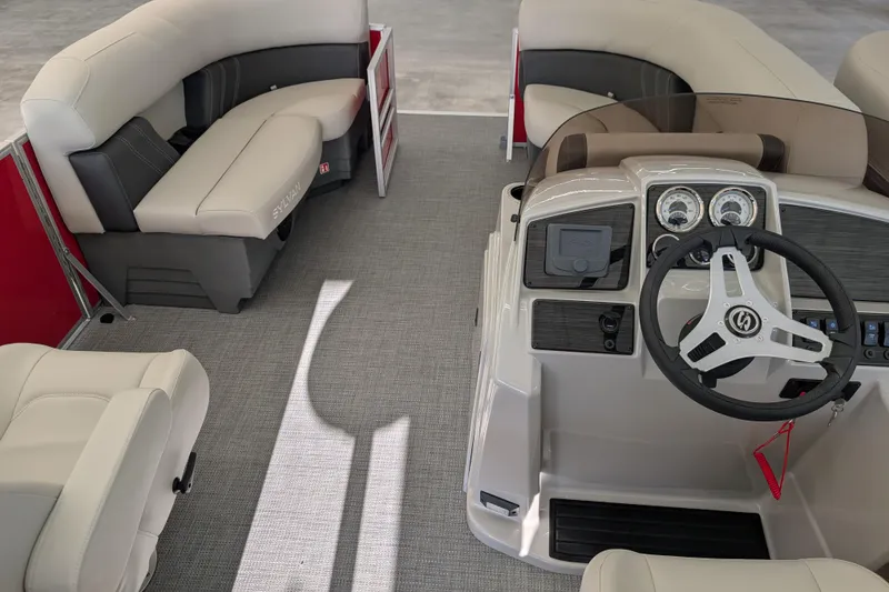 Slide: The Image of 2026 Sylvan Mirage 820 CLZ DH boat interior with modern helm and comfortable seating. - 8