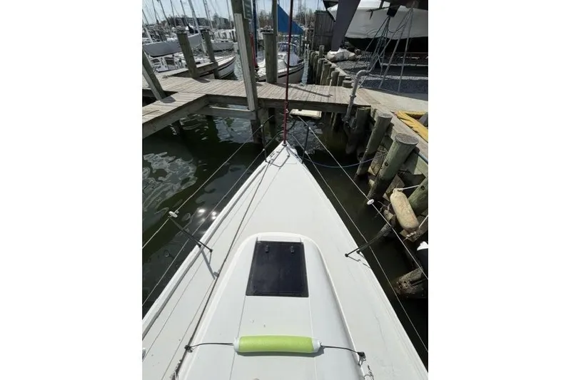 Slide: The Image of 2015 J Boats J/88 sailboat docked at a marina, view from the bow. - 13