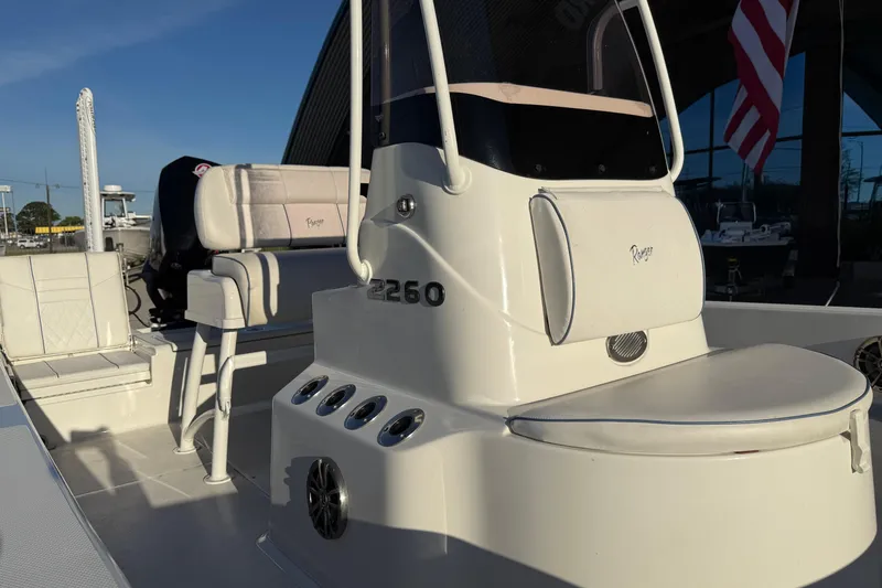 Slide: The Image of 2021 Ranger 2260 Bay Ranger boat interior with seating and console details. - 16