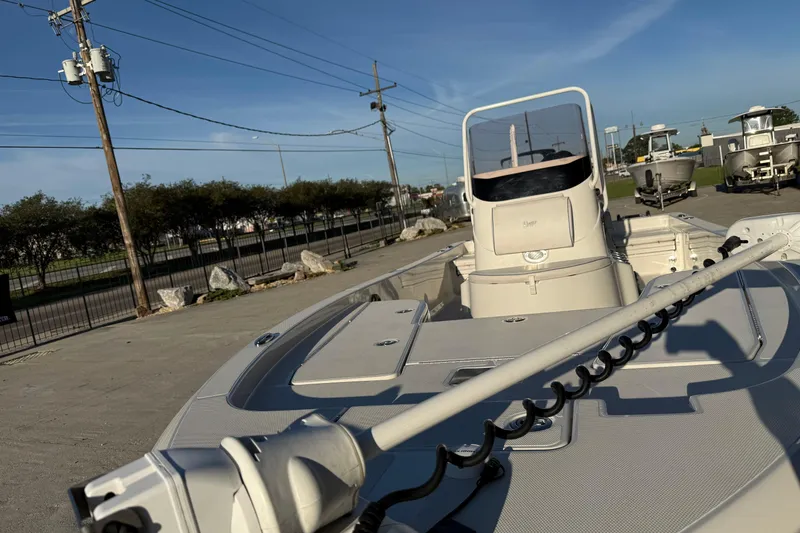 Slide: The Image of 2021 Ranger 2260 Bay Ranger boat on display in a sunny outdoor setting. - 5