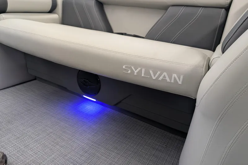 Slide: The Image of 2026 Sylvan Mirage Fish 8522 Party Fish boat interior with illuminated seating. - 2