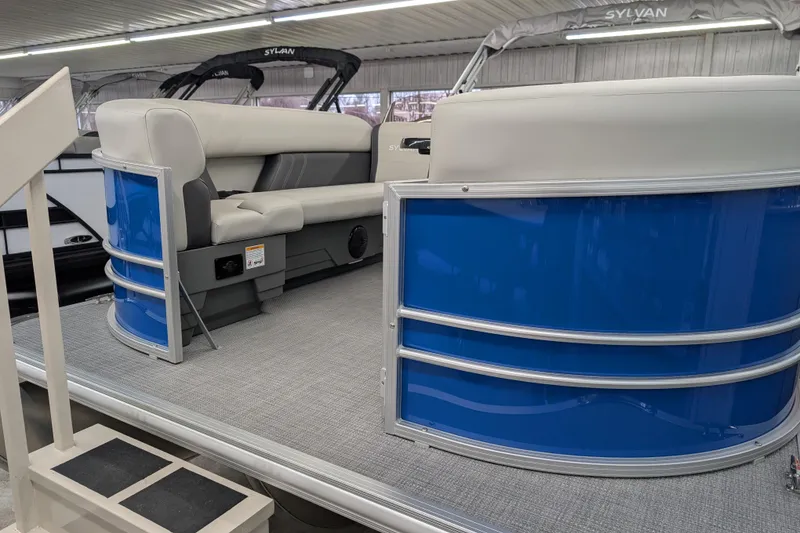Slide: The Image of 2026 Sylvan Mirage Fish 8522 Party Fish pontoon boat interior with blue paneling. - 4