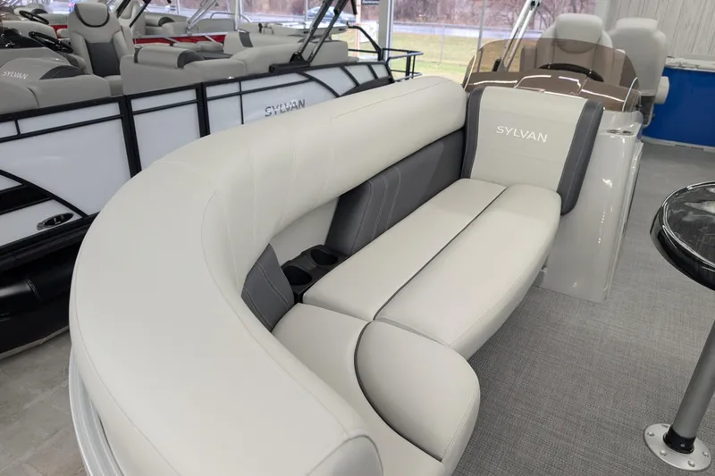 Slide: The Image of 2026 Sylvan Mirage Fish 8522 Party Fish boat interior with plush seating and modern design. - 5