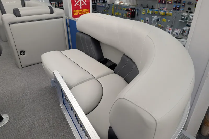 Slide: The Image of 2026 Sylvan Mirage Fish 8522 Party Fish boat interior with plush seating. - 6